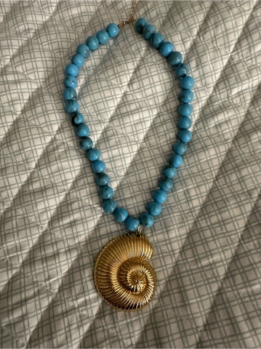 Turquoise Beaded Necklace with Gold Nautilus Pendant
